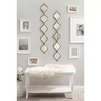 Miroir mural à panneau en forme de goutte Loxi en or 7"x42" Kate & Laurel All Things Decor