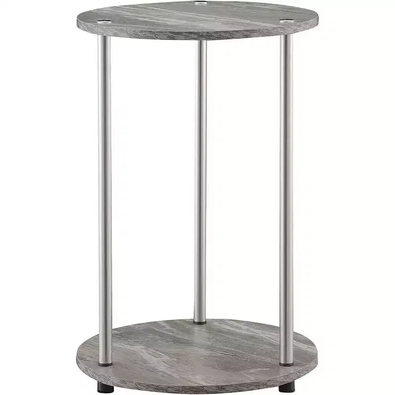Table d'appoint ronde à deux niveaux HomeStock Belmont avec pieds en acier inoxydable, étagères robustes en panneaux de particules et style moderne contemporain.