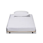 Baxton Studio Lit gigogne simple Alya blanc/doré : cadre en bois d'hévéa et MDF, pas besoin de sommier.