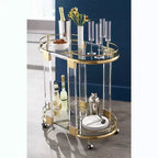 55 Downing Street Chariot de bar ovale Adaline de 75 cm de large en acrylique transparent et or
