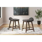 Tabouret de bar rembourré Signature Design by Ashley Lyncott à hauteur de comptoir avec coussin en mousse, lot de 2, gris anthracite