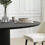 Table à manger ronde Dovelina noire, en bois artificiel, personnalisée avec un piètement design