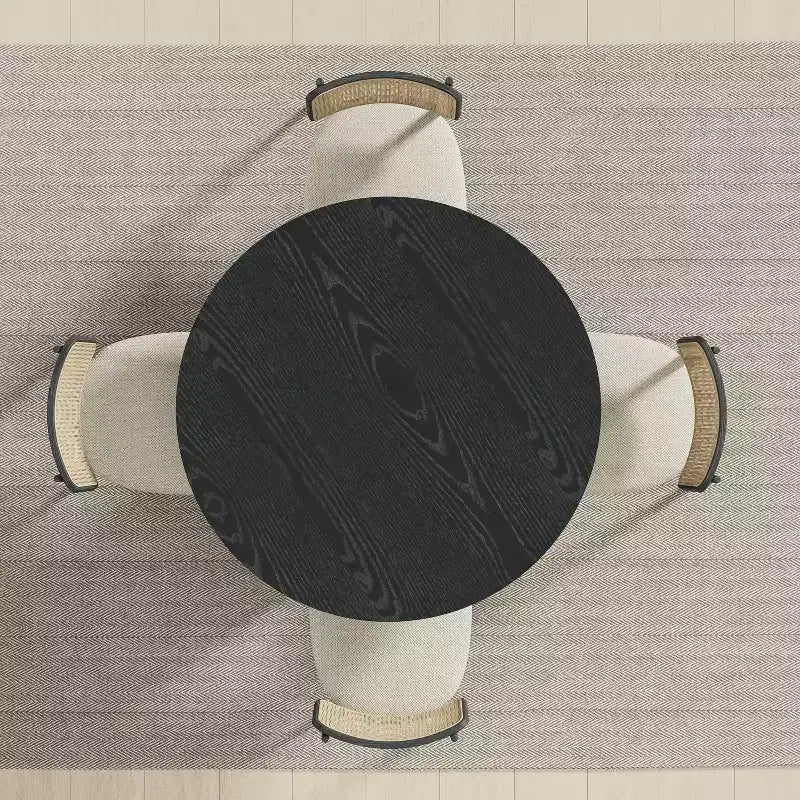Table à manger ronde Dovelina noire, en bois artificiel, personnalisée avec un piètement design