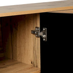 Grand meuble de rangement à portes sculptées et poignées métalliques